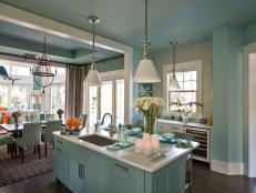 coastal-inspired kitchen flanked by dining and living areas