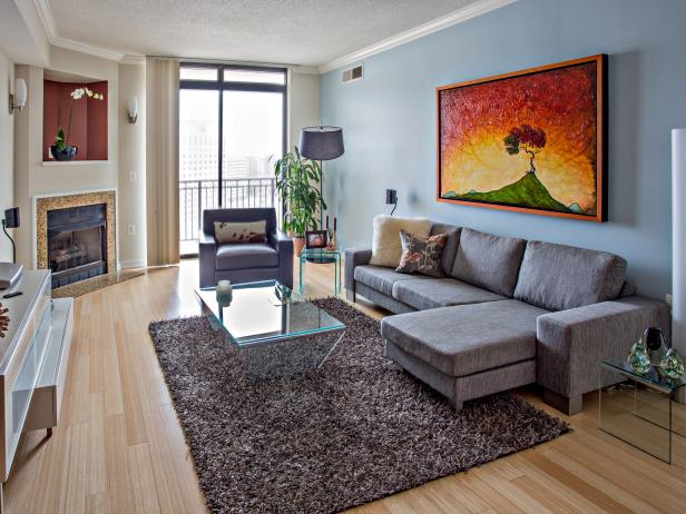 Living Space With Blue Accent Wall and Brown and Gray Decor