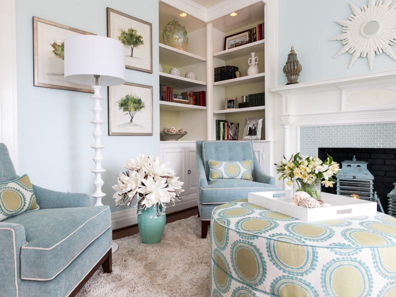 Blue Chairs with White Floor Lamp, Built-In Bookshelves and White Fireplace Mantel