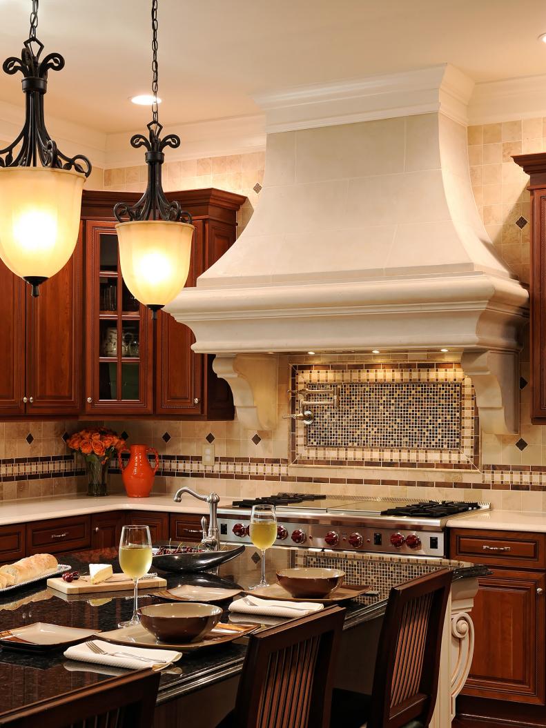 Large White Range Hood and Island in Old World Kitchen