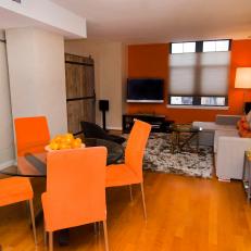 Orange Accents Light Up Transitional Living Space