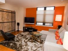 Orange Accent Wall Electrifies Contemporary Living Room
