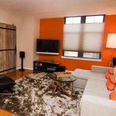 Orange Accent Wall Electrifies Contemporary Living Room