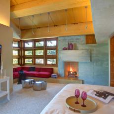 Contemporary Master Bedroom With Stone Fireplace
