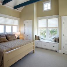 White Cottage Bedroom Exposes Blue Beams