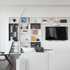 White Contemporary Living Room With Large Wall Shelving Unit
