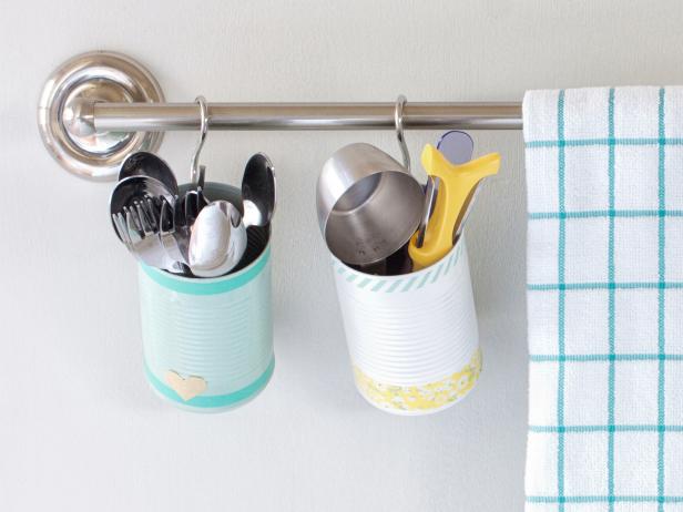 Looking for a pretty place to stash small kitchen items or herbs? Recycled tin cans create adorable utensil holders offering additional organization for storing kitchen gadgets.