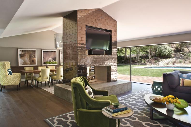 Neutral Contemporary Living Space With Fireplace and Green Chairs 