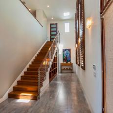 Modern Neutral Hallway With Warm Wood Stairs