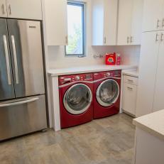 Modern White Kitchen With Red Washer and Dryer