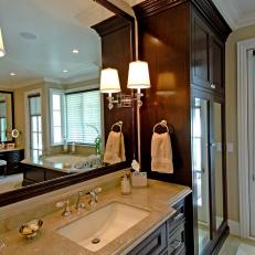 Traditional Neutral Bathroom With Dark Wood Cabinets and Marble Countertop 