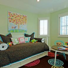 Transitional Kid's Room With Confetti Comforter and Polka Dot Details 
