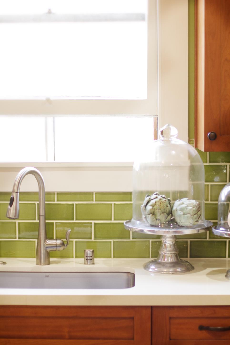 Craftsman Kitchen Sink With Green Tile Wall and White Stone Countertop