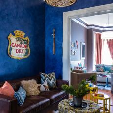 Vibrant Blue Living Room With Sparkly Drum Light