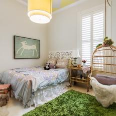 Playful Kid's Bedroom With Chevron Ceiling and Birdcage Chair