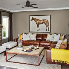 Cozy Living Room With Leather Sectional and Rustic Coffee Table