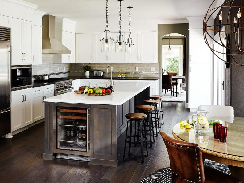 White Transitional Kitchen With Gray Island and Industrial Lighting