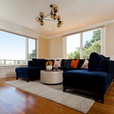 Open Contemporary Living Room With Dark Navy Sofa