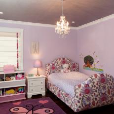 Girl's Lavender Bedroom With Chandelier and Floral Headboard