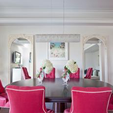 White Dining Room With Raspberry Upholstered Chairs