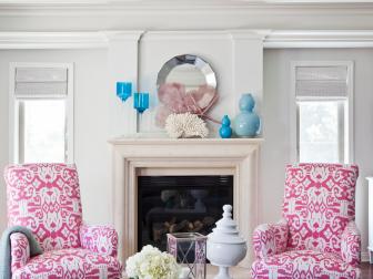 Neutral Transitional Living Room With White Fireplace and Pink Chairs
