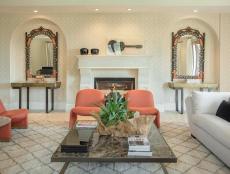Neutral formal living room with orange and gold accents