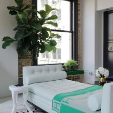 Elegant Loft Living Room With White, Tufted Daybed