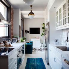 Sophisticated Galley Kitchen With Teal Runner