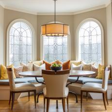 Transitional Dining Room with Three Arched Windows 