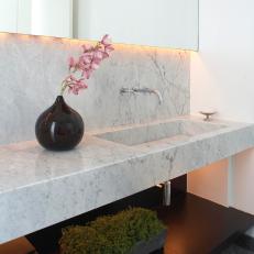 Contemporary Powder Room With Marble Countertops