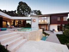 Modern Home Exterior with Infinity Pool and Stone Patio