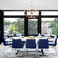 Sleek and Stylish Dining Room With Blue Chairs