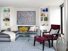 Modern Living Room With Maroon Chair and Greek Key Rug