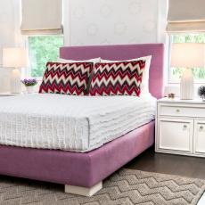 Sophisticated Girl's Room With Upholstered Lilac Bed and Chevron Pillows