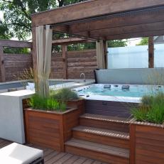 Relaxing Hot Tub Retreat With Cedar Pergola and Outdoor Seating