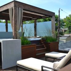 Hot Tub Retreat With Pergola, Outdoor Seating and Bar Area