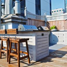 Contemporary Roof Deck With Wooden Barstools and Outdoor Bar