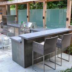 Backyard Sanctuary With Bar Area With Concrete Countertops