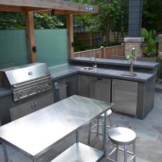 Backyard Sanctuary With Outdoor Kitchen and Bar Area