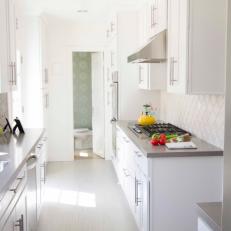 Contemporary Galley Kitchen Goes White and Bright