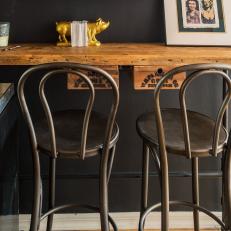Rustic Wood Bar With Vintage Metal Barstools