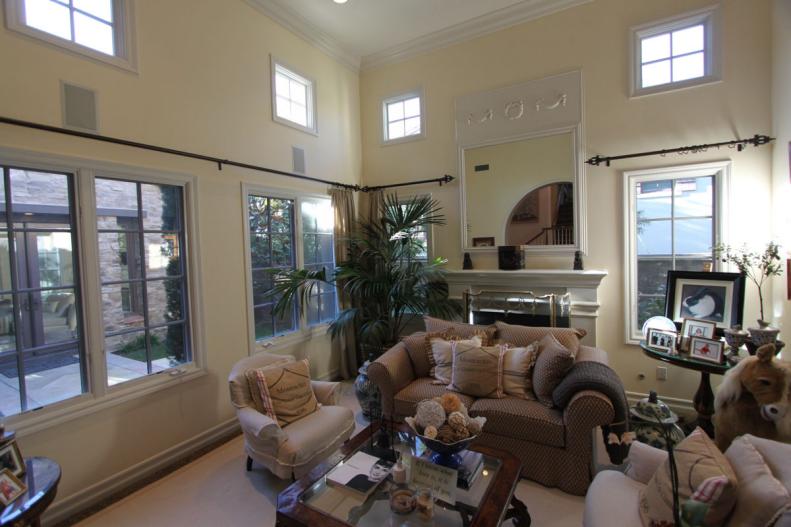 Large Buttercream Living Room With Second-Story Windows