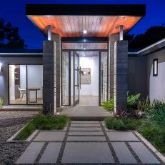 Modern Ranch-Style Home With Concrete Paver Walkway