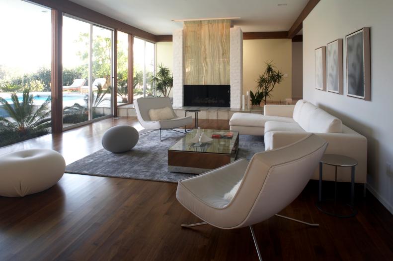 White Modern Living Space With Hardwood Floors and White Furniture