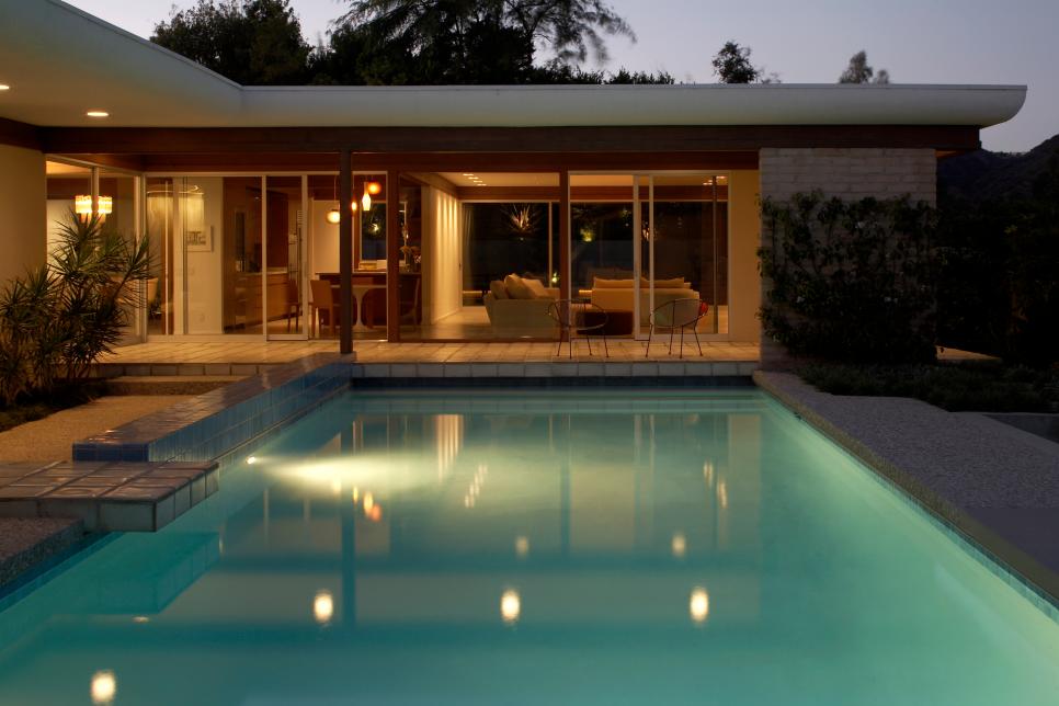 Midcentury Modern Exterior With Pool and White Roof
