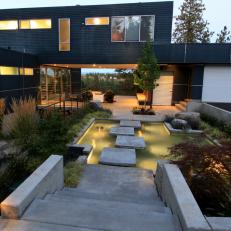 Floating Stepping Stones Lead to Modern Home