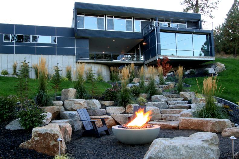 Modern Blue Home Exterior With Backyard Landscape and Hardscape