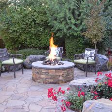 Backyard Patio With Round Stone Fire Pit