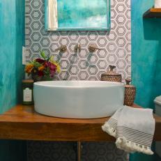 Teal Powder Room With Round Basin Sink and Wood Countertop