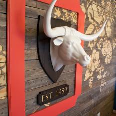 Wood Wall With Faux Mounted Bull Head in Transitional Guest Room